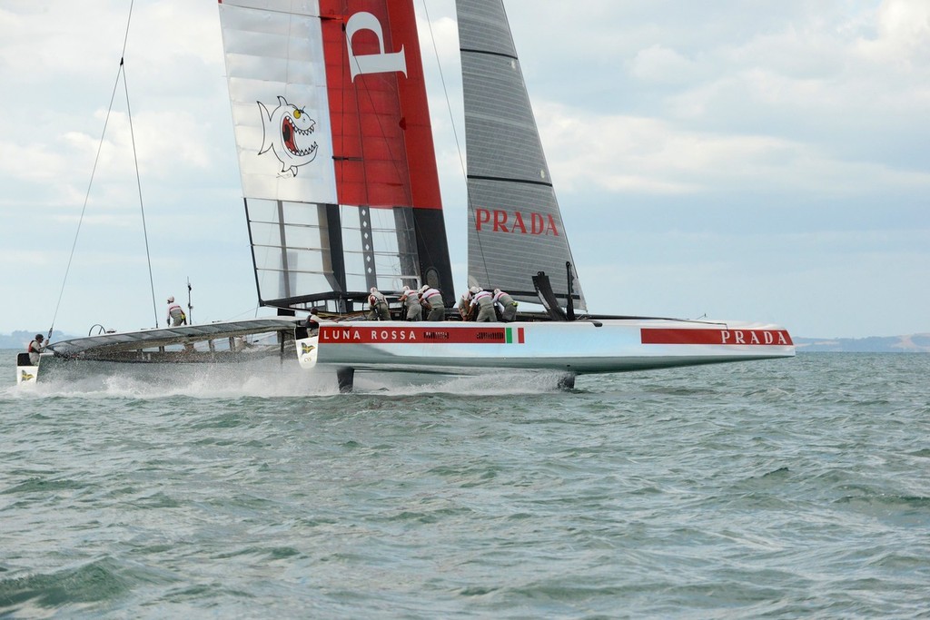 Luna Rossa turns down into the gybe - Note the port (old leeward foil can be seen in the fully raised position through the clear section of the wingsail - Emirates Team NZ and Luna Rossa Race Training - March 6, 2013 © Sail-World.com/NZ 